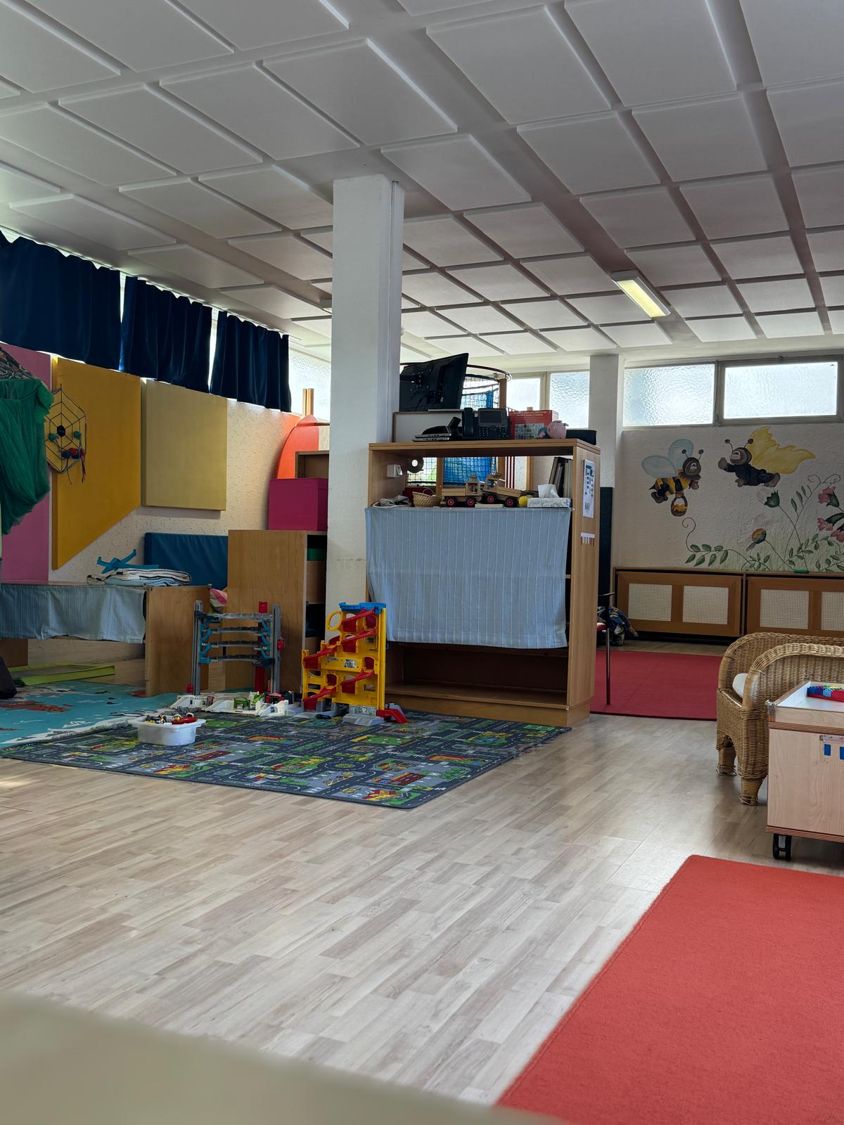 Children's creative work displayed on shelves and walls