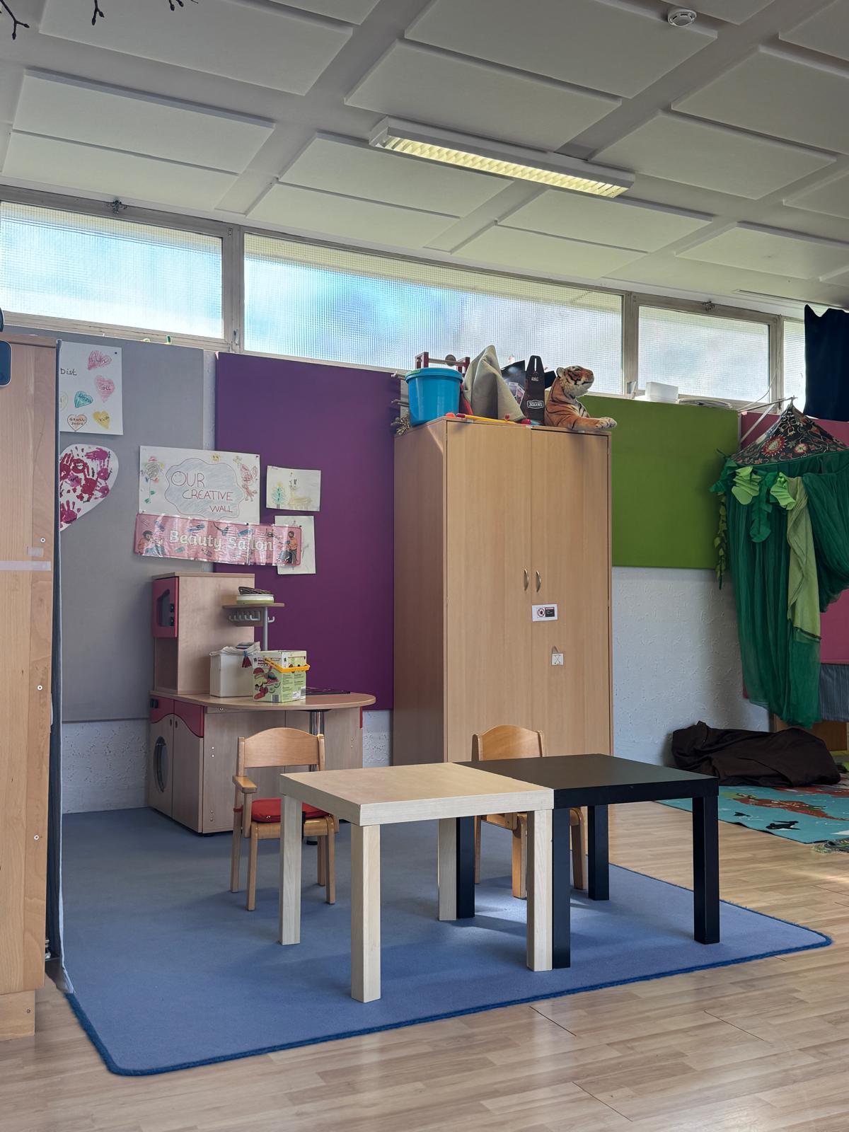 Indoor play area with toys and open floor space